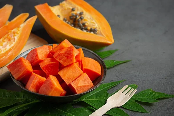 fresh-papaya-cut-into-pieces-put-black-plate copy